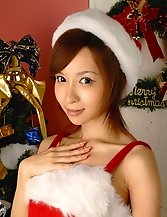 Cute sexy asian girl in santa costume flashes her panty
