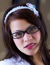 Dar posing as a schoolgirl with glasses